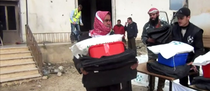 Syrian Man receives Irish Aid Emergency Pack at Goal distribution post in Northern Syria.