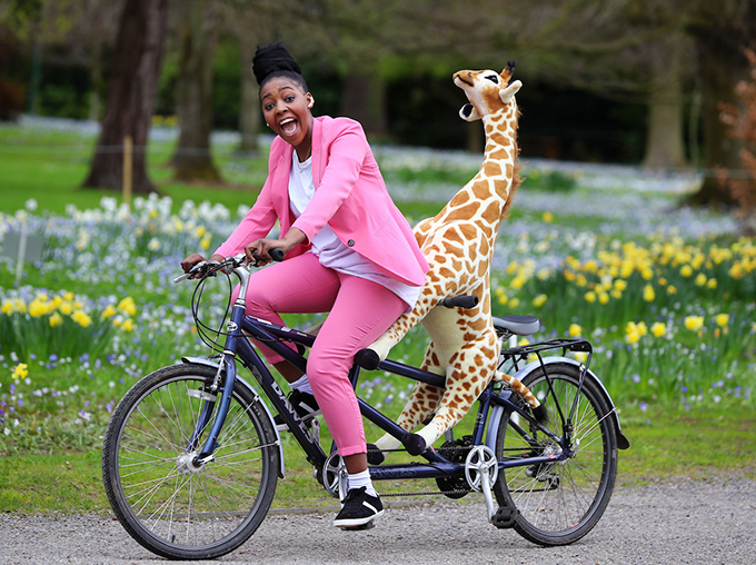 Africa Day champion Onai Tafuma with Gemma the Giraffe