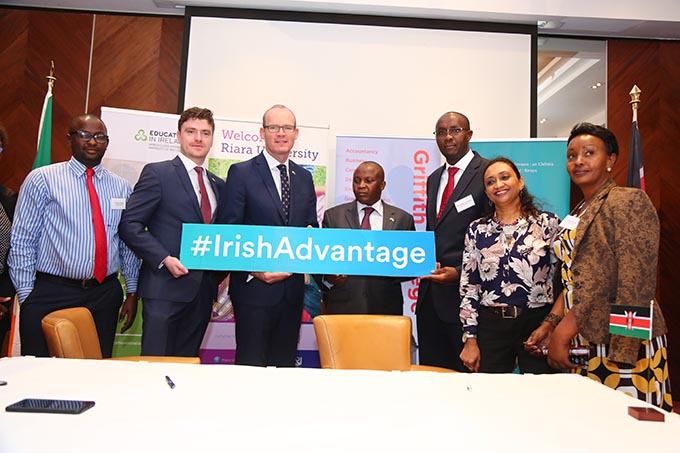 Minister Coveney with representatives of Riara University and Griffith College